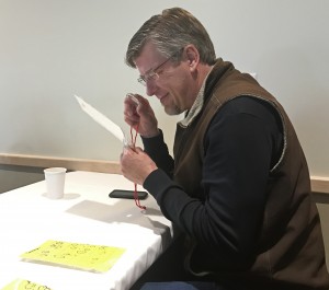 a man looking at papers